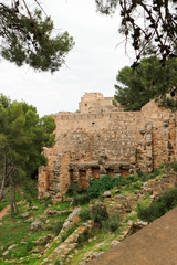 Road under the wall of old medieval Sagunto fortress, Valencia, Spain