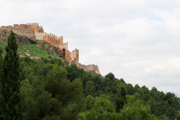 Fototapeta na wymiar Beautiful medieval Sagunto castle on the green hill in Spain