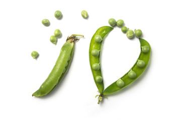 Closeup of fresh organic peas on white background