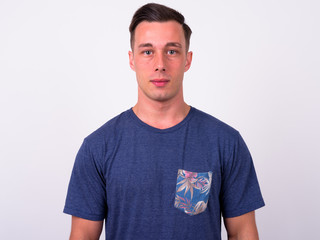 Fototapeta premium Portrait of young handsome man looking at camera