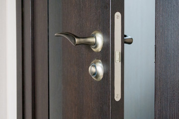 Wooden door is slightly open into the room. Conception of secret or horror scene