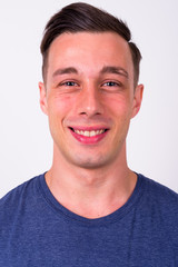 Fototapeta premium Face of happy young handsome man smiling