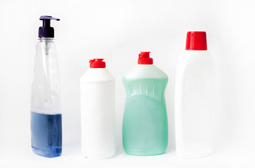 Some
different bottles with detergents and disinfectants on a white background