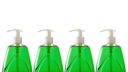 Green liquid soap in plastic bottles