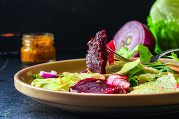 healthy salad beetroot slices, iceberg lettuce, greens. Menu concept food background, keto or paleo...