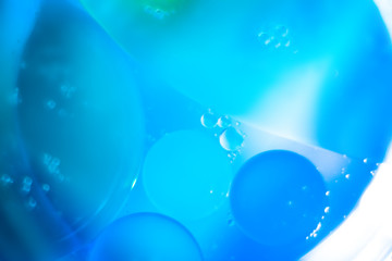 abstract background with bubbles oil drops on the water surface