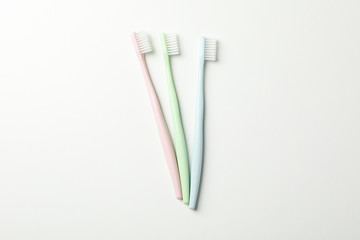 Toothbrushes on white background, top view. Dental care