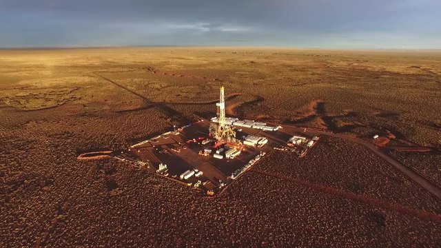 Vaca Muerta, Argentina, January 12, 2016: Extraction of unconventional oil. Battery of pumping trucks for hydraulic fracturing (Fracking).