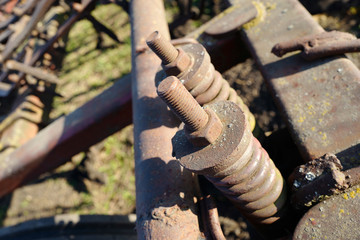 Rusty bolts and nuts on agricultural machinery
