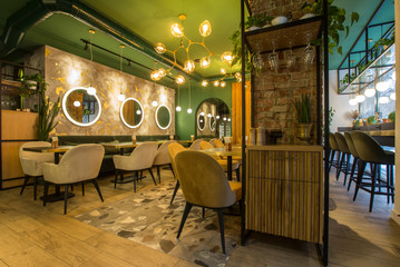 Urban cafe interior with cozy atmosphere, avocado color walls