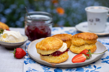 Freshly baked home made scones with strawbery jam and clotted cream
