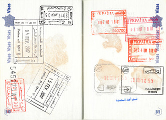 Stamps of Tunisia, Morocco, Ukraine and Moldova in a French passport. Personal data removed