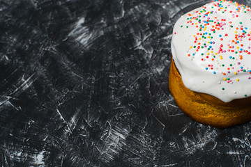 Black-and-white background with easter cake. Top view