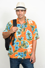 Portrait of mature handsome tourist man with backpack