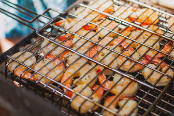 Cooking shrimps on barbecue 