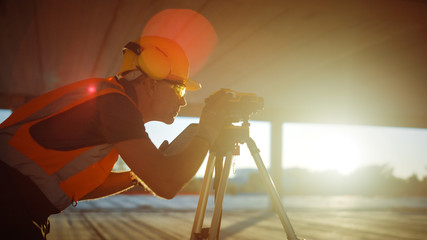 Inside of the Commercial / Industrial Building Construction Site: Professional Engineer Surveyor...