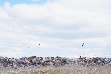 huge pile of garbage in a city dump on gloomy day. Keeping the environment clean. Ecological problems.