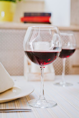 Glass of red wine on a table in a restaurant