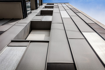 Modern building facade with grey steel and windows