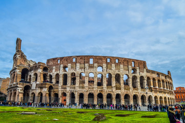 Fototapeta na wymiar Artistic ruins of Roman Colosseum or coloseum an ancient gladiator Amphitheatre in Rome Italy