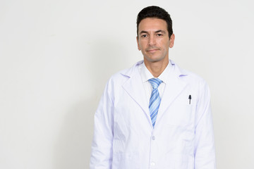 Portrait of mature handsome man doctor looking at camera