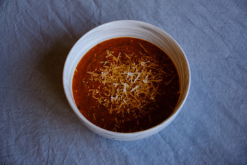 Homemade tomato soup with parmesan cheese