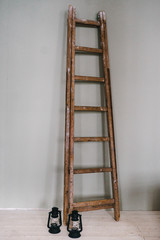Old wooden staircase. Candlesticks against the wall