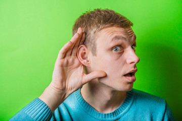 young man eavesdropping