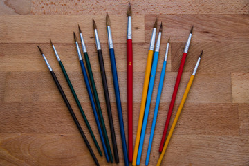 Obraz premium brushes on wooden table