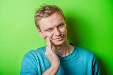 a young man with a toothache