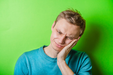 a young man with a toothache