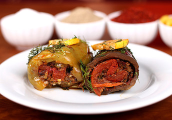 Eggplant and green bell peppers with delicious vegetables are ready to serve