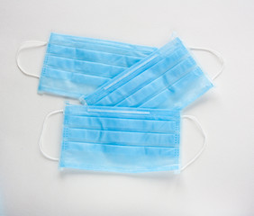 Surgical mask with rubber ear straps. Typical 3-ply surgical mask to cover the mouth and nose. Procedure mask from virus.