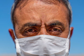 Close up view of man with mask.
