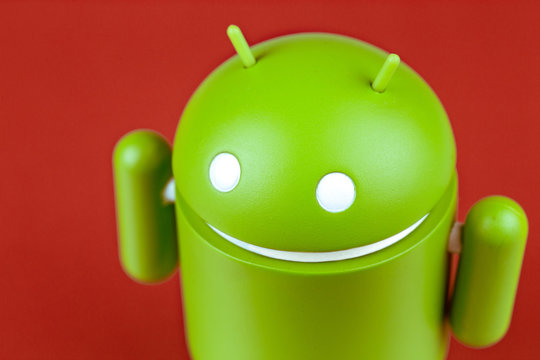Google Android figure on red background. Google Android is the operating system for smartphones, tablet computers, e-books and other devices. Moscow, Russia - March 20, 2019