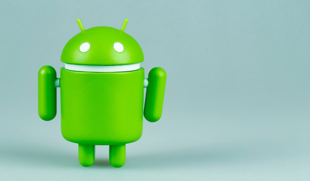 Google Android figure on the blue background. Google Android is the operating system for smartphones, tablet computers, e-books and other devices. Moscow, Russia - March 21, 2019