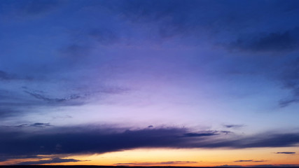 bright blue sky with orange sunset at evening