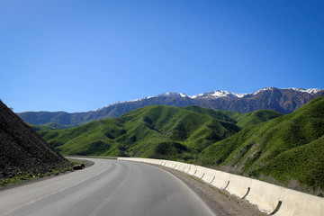 Fototapeta premium Calm green hills landscape near Jalal-Abad by spring, Kyrgyzia