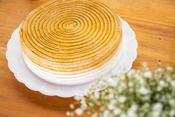 Golden and white birthday cake
