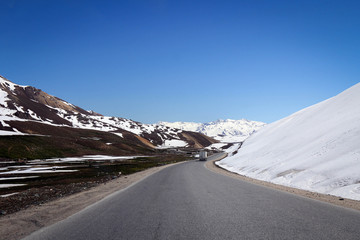 Snowy road through Tian Shan mountains view, Kyrgyzia