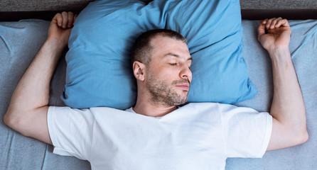 Man Sleeping And Snoring Lying In Bed In Bedroom, Top-View