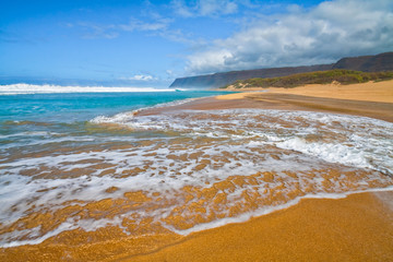 Fototapeta na wymiar The Golden Sand of Polihale Beach With Rhe Na Pali Cliffs in The Distance, Polihale Beach State Park, Kauai, Hawaii, USA