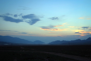 Scenic misty summer landscape near Karakol town, Kyrgyzia