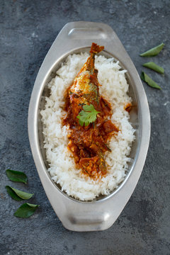 fish curry with rice, indoor lighting setup