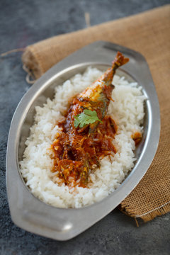 fish curry with rice, indoor lighting setup