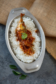 fish curry with rice, indoor lighting setup