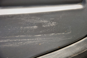 
gray car with a scratch