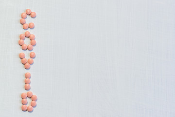 The word COVID from the tablets is on a white table. The global problem of the spread of serious disease. Copy space