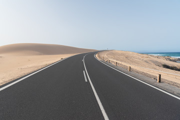 Fototapeta na wymiar road in the desert dunes