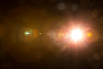Abstract Natural Sun flare on the black background.